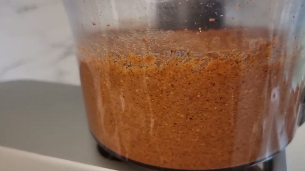 Roasted almonds ground into a runny paste in a food processor