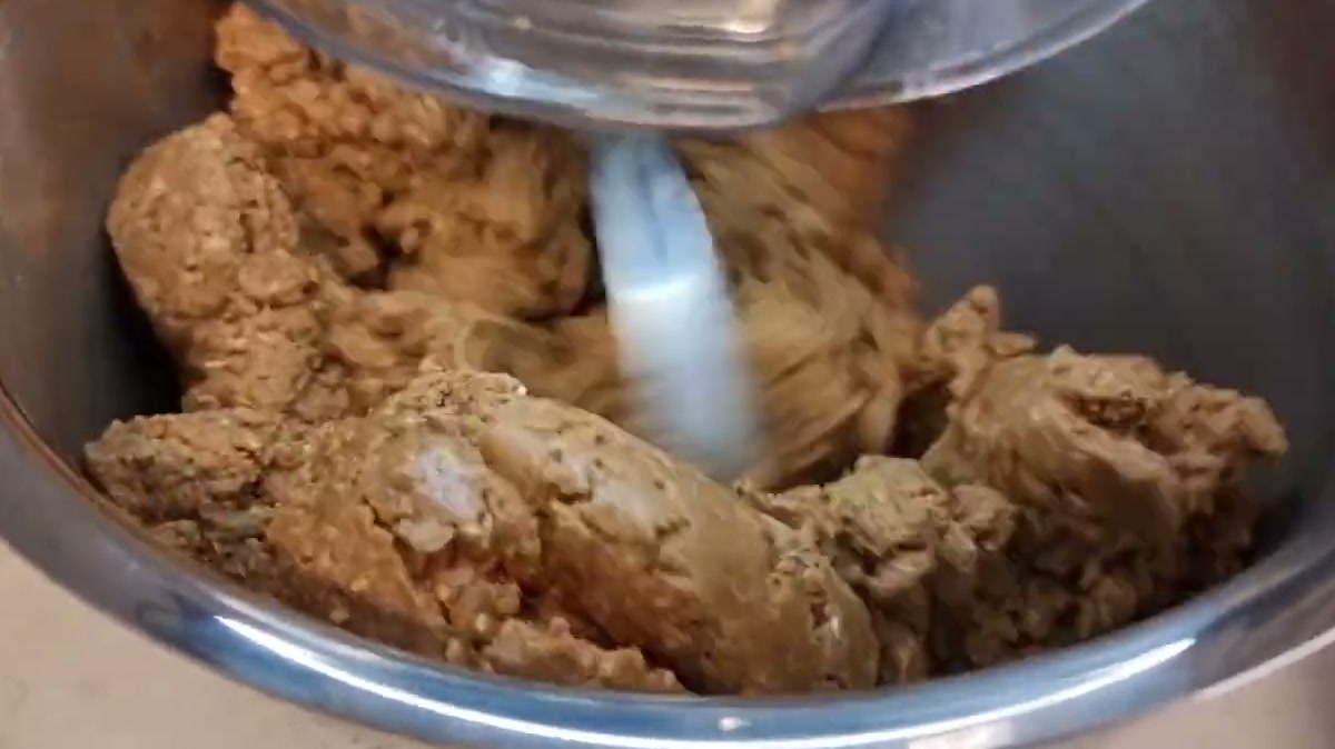 Kneading the sellou in a stand mixer until it becomes moist and holds together