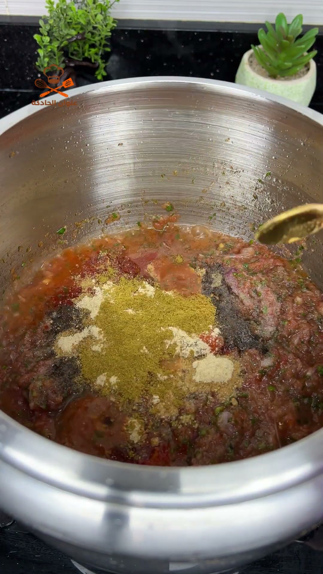 Paprika, black pepper, ginger and cumin added to the tomato and meat sauce