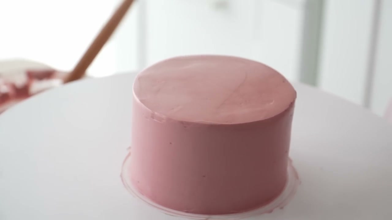 A bento cake covered in smooth dusty pink buttercream