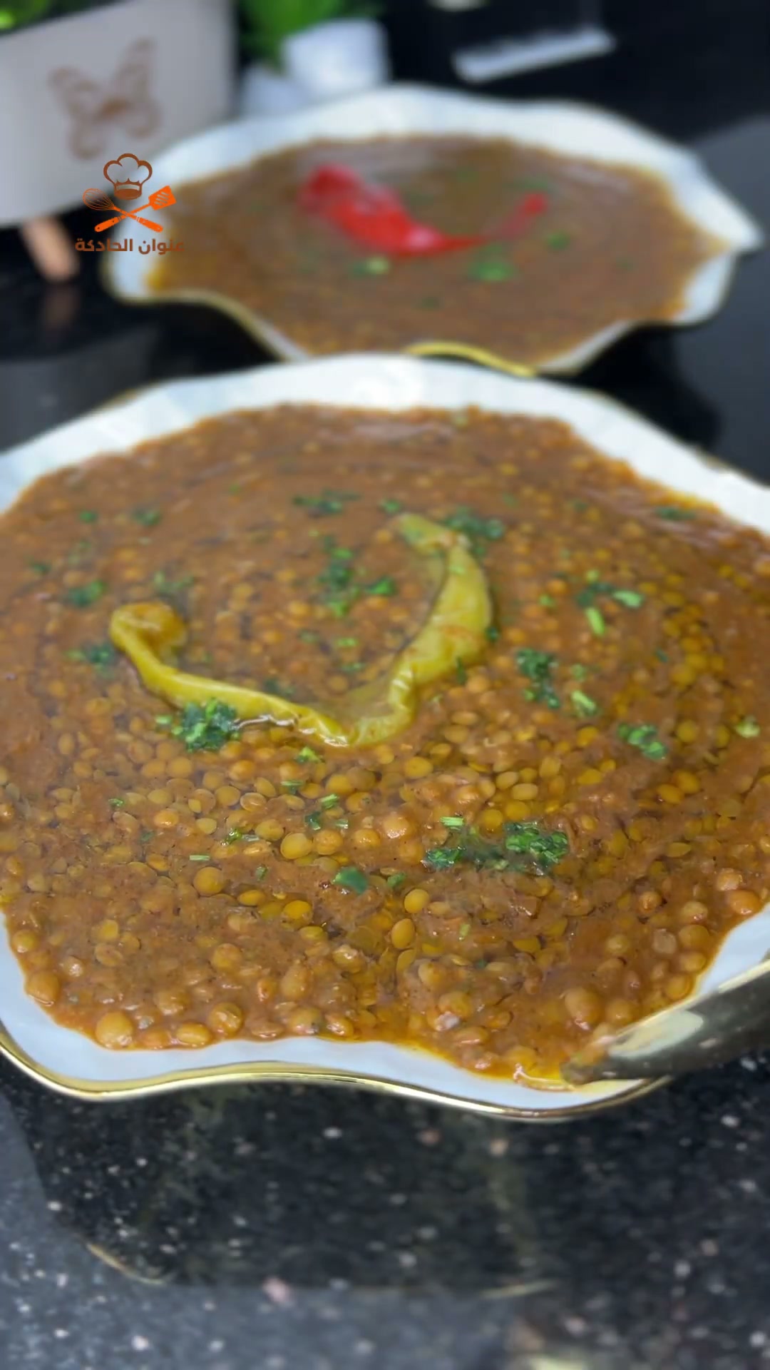 A spoonful of tender Moroccan lentils in their tomato sauce
