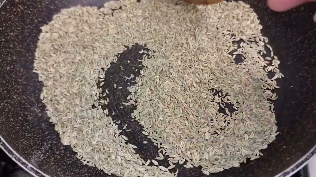 Warming fennel seeds in a dry pan to bring out their aroma